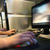 stock photo computer gaming at internet cafe